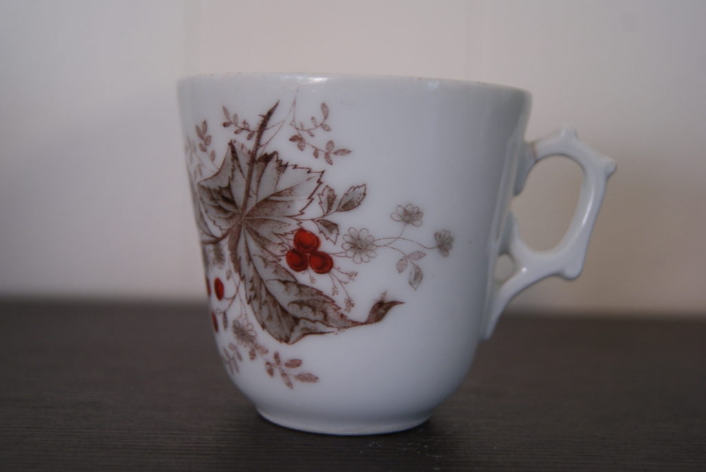 Porsgrund coffee cup with bird on rowan. Leaves, flowers and red fruits