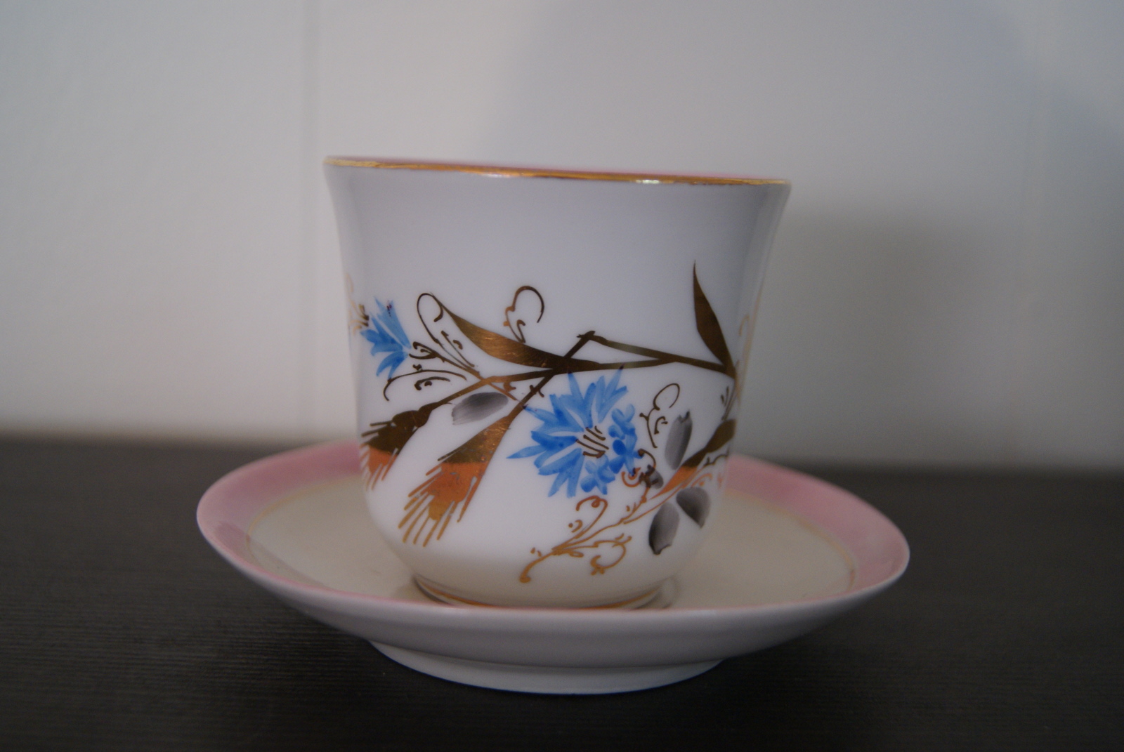 Waldenburg - Altwasser tea cup with saucer decorated with blue flowers, golden leaves and pink rim