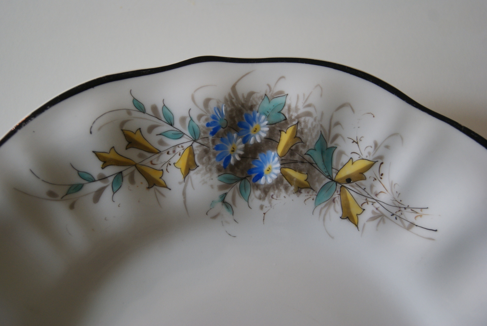 Waldenburg dish with blue and white flowers, leaves and black rim