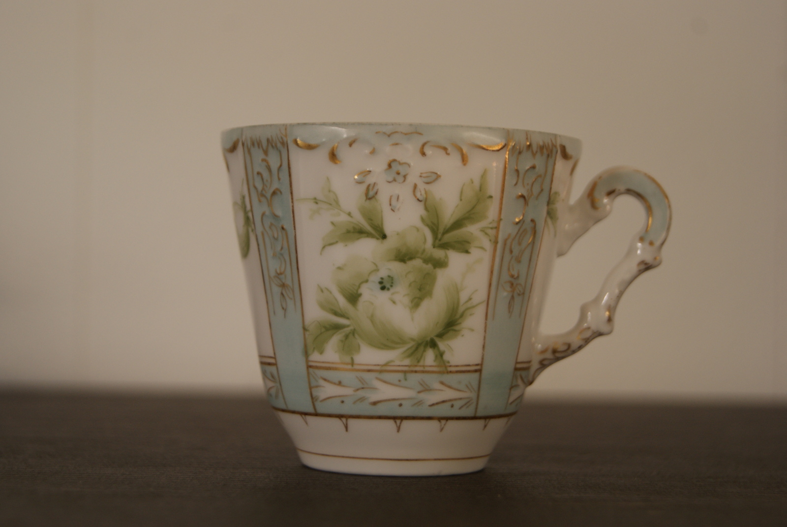 Niedersaltzbrunn Hermann Ohme cup with saucer and plate, handpainted green flowers and leaves, blue color, golden decor