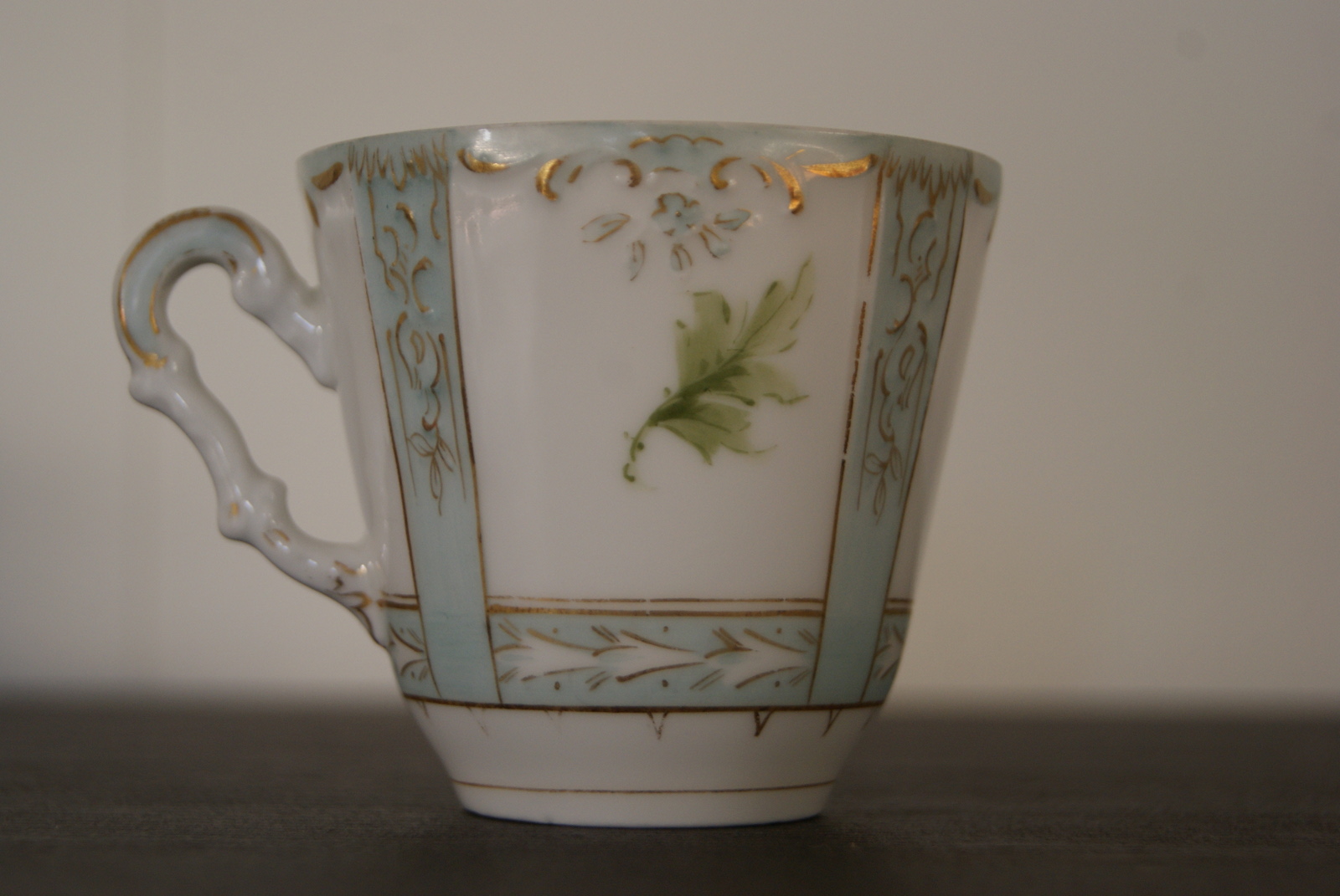 Niedersaltzbrunn Hermann Ohme cup with saucer and plate, handpainted green flowers and leaves, blue color, golden decor