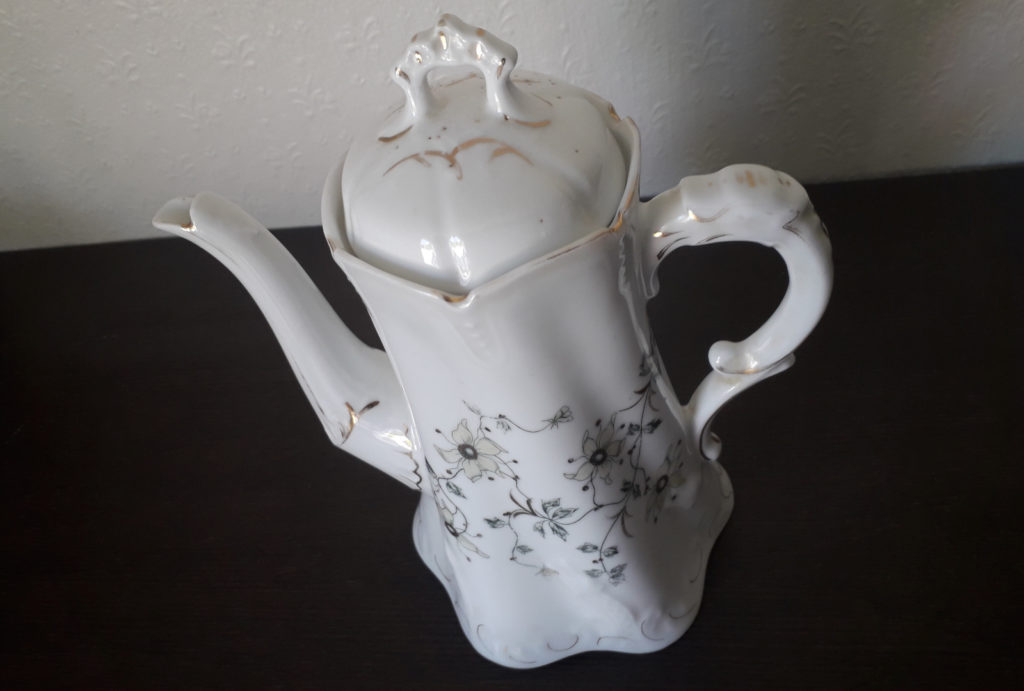 Porsgrund coffee pot with white flowers, relief and golden decor