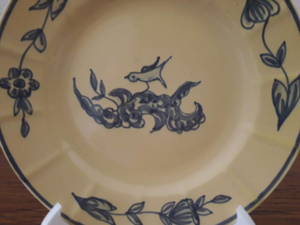 Egersund yellow glaze plate with hand painted rococco decor with blue bird and flowers