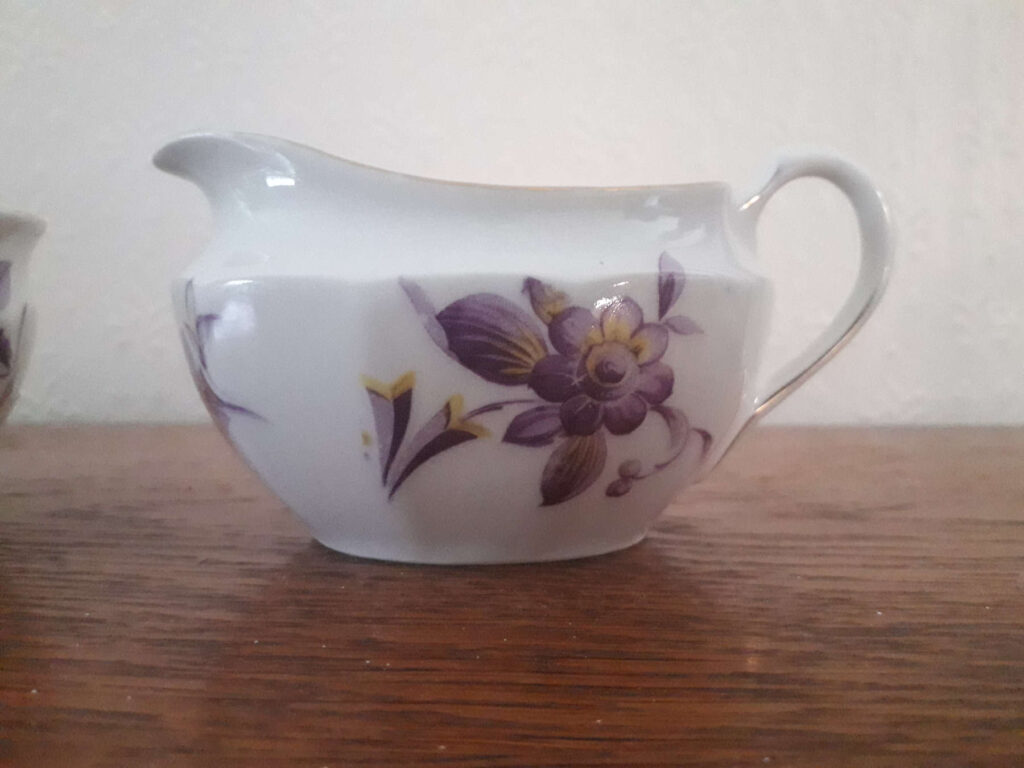 Parowa (Tiefenfurt) milk jug and sugar bowl with yellow and purple flower