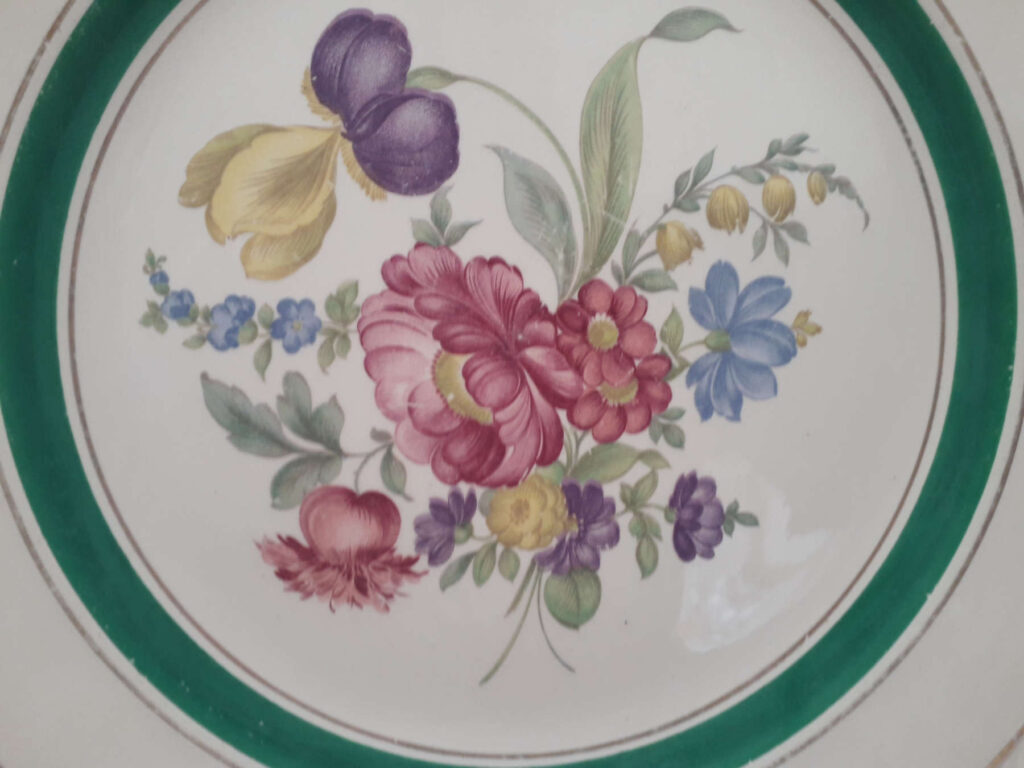 Stavangerflint plate with meissen flowers, green band and relief