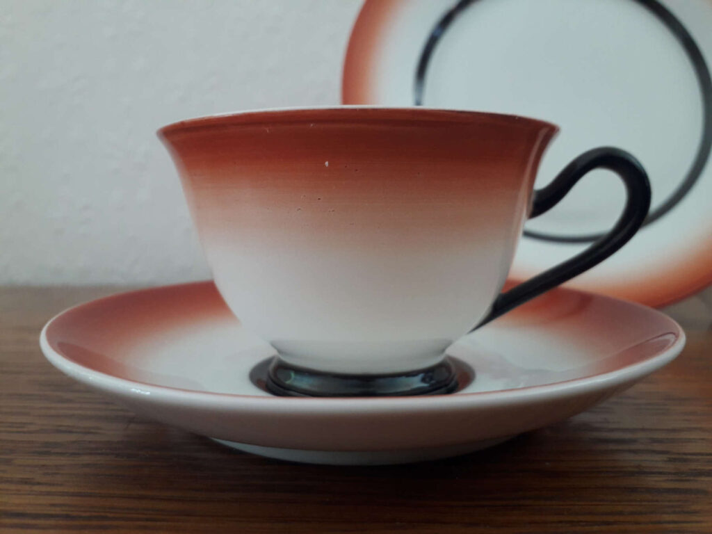 Porsgrunds Porselænsfabrik cup with saucer and plate with red and black bands
