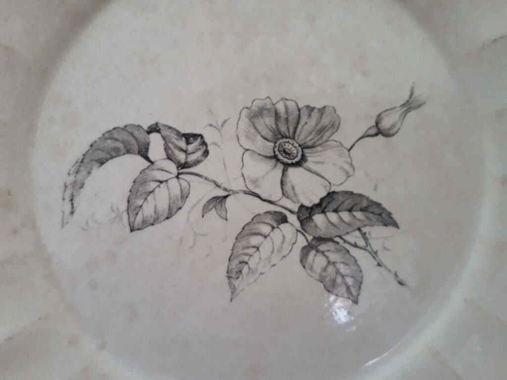 Egersunds Fayancefabrik plate decorated with flowers and insects