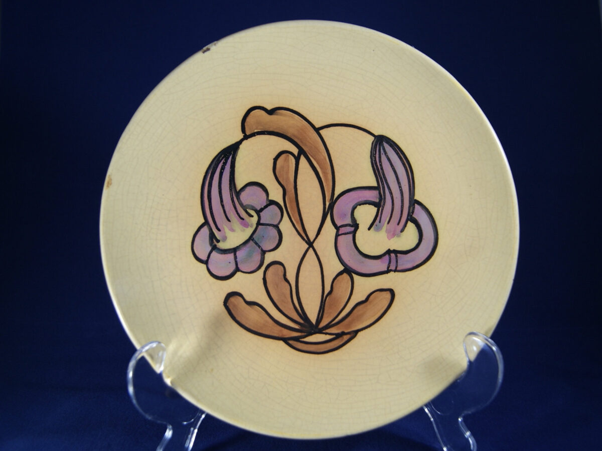 Egersunds Fayancefabrik plate with purple flowers and yellow glaze